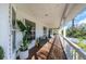 Charming wrap-around balcony featuring comfortable seating perfect for enjoying the outdoors at 2371 Scenic Dr, Venice, FL 34293