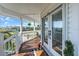 Inviting front porch with wood flooring and a beautiful view of the river, perfect for relaxing at 2371 Scenic Dr, Venice, FL 34293