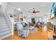 Spacious living room featuring a staircase, hardwood floors, neutral colors and a fireplace at 2371 Scenic Dr, Venice, FL 34293