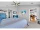 Bright main bedroom featuring a king-size bed and a flat screen television at 2371 Scenic Dr, Venice, FL 34293