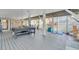 Large covered patio space with entertainment equipment and outdoor games at 2371 Scenic Dr, Venice, FL 34293