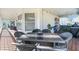 Enjoy outdoor dining on this porch with string lights, comfortable seating and relaxing views at 2371 Scenic Dr, Venice, FL 34293