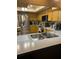 Kitchen features stainless steel appliances and laminate countertops and warm wood cabinets at 2537 Northway Dr, Venice, FL 34292
