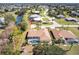 Overhead shot of a lovely residence with a screened pool, nestled in a community with a picturesque waterfront at 255 San Cristobal Ave, Punta Gorda, FL 33983