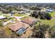 Bird's eye view of the property highlighting the house with a screened-in pool and beautifully landscaped surroundings at 255 San Cristobal Ave, Punta Gorda, FL 33983