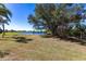 Serene backyard view with a large pond and a picturesque setting, showcasing the natural beauty of the property at 255 San Cristobal Ave, Punta Gorda, FL 33983