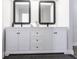 Bathroom vanity with double mirrors, white cabinets, black hardware and gray countertop at 255 San Cristobal Ave, Punta Gorda, FL 33983