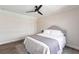 Cozy bedroom showcases a ceiling fan, soothing colors, and plush bedding creating a tranquil retreat at 255 San Cristobal Ave, Punta Gorda, FL 33983