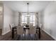 Formal dining area with stylish furniture, a decorative chandelier, and elegant window treatments at 255 San Cristobal Ave, Punta Gorda, FL 33983