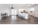 Open-concept kitchen with a large island, seating, stainless steel appliances and white cabinetry at 255 San Cristobal Ave, Punta Gorda, FL 33983