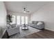 Bright living room featuring modern furniture, wood floors, and access to outdoor area through french doors at 255 San Cristobal Ave, Punta Gorda, FL 33983