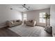 Bright living room featuring neutral furniture, wood floors, and shuttered windows at 255 San Cristobal Ave, Punta Gorda, FL 33983