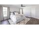 Bright and airy main bedroom with a comfortable bed, modern decor and dark ceiling fan at 255 San Cristobal Ave, Punta Gorda, FL 33983