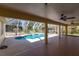 Screened lanai with pool, ceiling fans, tile flooring, and an outdoor oasis for relaxation and enjoyment at 255 San Cristobal Ave, Punta Gorda, FL 33983