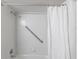 Shower featuring a handrail, chrome fixtures, and a white curtain at 255 San Cristobal Ave, Punta Gorda, FL 33983