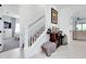 Open hallway featuring stairs, decor, and seamless transition to a bedroom at 276 Caserta Ct, North Venice, FL 34275