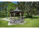 Charming gazebo on a well-maintained lawn, perfect for outdoor relaxation and community gatherings at 3093 S Haberland Blvd, North Port, FL 34288