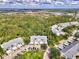 A scenic aerial view of condos with lush green surroundings and convenient parking at 310 Lynbrook Cir # 103, Venice, FL 34292