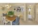 Inviting dining area featuring a chandelier and seating for four near the kitchen at 310 Lynbrook Cir # 103, Venice, FL 34292