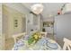 Bright kitchen featuring a blue and white wallpaper design that leads into the eating area at 310 Lynbrook Cir # 103, Venice, FL 34292