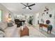 Inviting living room with a view to the pool table room, neutral colors, and stylish decor at 316 Wexford Ter # 167, Venice, FL 34293