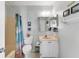 An efficient bathroom layout with a shower, toilet, vanity, and essential fixtures at 3300 Loveland Blvd # 1201, Punta Gorda, FL 33980
