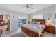 Comfortable main bedroom with a large bed, ensuite access, and sliding glass doors at 3300 Loveland Blvd # 1201, Punta Gorda, FL 33980