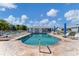 Sparkling community pool area with lounge chairs, offering a perfect relaxation spot at 3300 Loveland Blvd # 1201, Punta Gorda, FL 33980