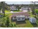 Aerial view of the home with a spacious yard and detached storage shed at 3716 Dunbar Rd, Venice, FL 34293
