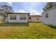 A charming backyard with a shed, sitting on a lush green lawn near house at 3716 Dunbar Rd, Venice, FL 34293