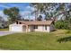 Inviting single-story home with lush lawn, a garage and well-maintained exterior paint at 3716 Dunbar Rd, Venice, FL 34293