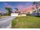 Beautiful single-story house featuring a wide lawn and concrete driveway at 3716 Dunbar Rd, Venice, FL 34293