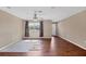 Bright living room with beautiful hardwood floors and natural light coming through the window at 3716 Dunbar Rd, Venice, FL 34293