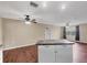 Spacious living room featuring wood floors, recessed lighting, and a ceiling fan at 3716 Dunbar Rd, Venice, FL 34293