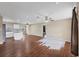 Spacious living room with hardwood floors and natural light, needs new floor covering in spots at 3716 Dunbar Rd, Venice, FL 34293