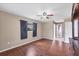 Spacious main bedroom with a ceiling fan, dark wood floors, and neutral colored walls at 3716 Dunbar Rd, Venice, FL 34293