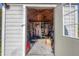 Inside a shed with a lawn mower, ladder, and organized storage at 3716 Dunbar Rd, Venice, FL 34293