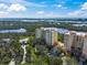 Aerial view of beautiful condos close to water, mangroves, and the intercoastal at 385 N Point Rd # 404, Osprey, FL 34229