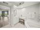 Bright bathroom featuring vanity with seating, soaking tub, and access to the Primary bedroom at 385 N Point Rd # 404, Osprey, FL 34229