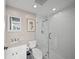 Bathroom featuring modern shower with glass door, toilet and sink at 385 N Point Rd # 404, Osprey, FL 34229
