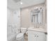 Bathroom featuring a tub with glass door, sink and toilet at 385 N Point Rd # 404, Osprey, FL 34229