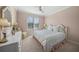 Bedroom featuring a large window, pastel walls and bright furnishings at 385 N Point Rd # 404, Osprey, FL 34229