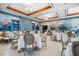 Elegant dining area with mural, architectural details and modern lighting at 385 N Point Rd # 404, Osprey, FL 34229