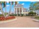 Stately building with portico, columns, circular drive and mature landscaping at 385 N Point Rd # 404, Osprey, FL 34229