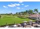 Patio area overlooking golf course and landscaped grounds at 385 N Point Rd # 404, Osprey, FL 34229