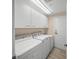 Laundry room featuring modern washer, dryer, and ample storage space at 385 N Point Rd # 404, Osprey, FL 34229