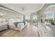 Serene main bedroom boasts a luxurious design with balcony access and lots of natural light and views at 385 N Point Rd # 404, Osprey, FL 34229