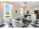 Comfortable sitting area with natural light, neutral decor and decorative lighting at 385 N Point Rd # 404, Osprey, FL 34229