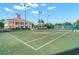 Enjoy a match on well-maintained tennis courts with the clubhouse in the background, perfect for sports enthusiasts at 385 N Point Rd # 404, Osprey, FL 34229