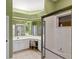 Bright bathroom featuring a glass shower, tile floors, and large mirrors at 446 Pinewood Lake Dr, Venice, FL 34285